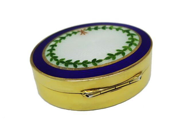 Snuff Box or Pill Box in 925/1000 sterling silver gold plated with translucent fired enamel on guillochè and hand painted miniature of floral wreath. Back side