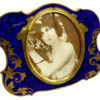 Salimbeni Guilloche Frame Hand-Engraved Shaped photo frame with oval interior in 925/1000 sterling silver gold plated . Oval Shape with blue back ground and gold plated hand-carved decoration. Right side front view