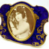 Salimbeni Guilloche Frame Hand-Engraved Shaped photo frame with oval interior in 925/1000 sterling silver gold plated . Oval Shape with blue back ground and goldplated hand-carved decoration. Right side front view