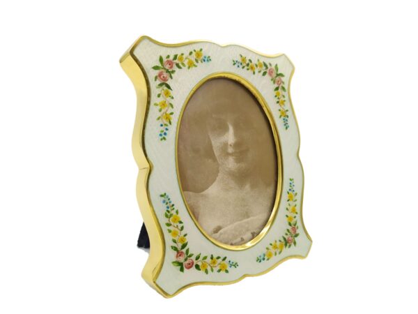 Salimbeni1891 Shaped Photo Frame in Sterling Silver with fired White enamels on guilloche and hand painted floral miniatures. 1 scaled